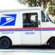 Usps Truck Delivering Mail On Suburban Street Parked In Occupied Space