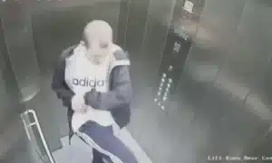 Man abusing dog in the elevator