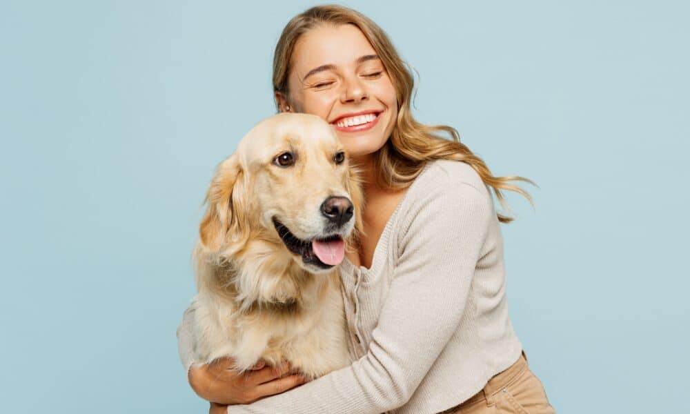 Young Smiling Happy Cheerful Owner Woman With Her Best Friend Retriever